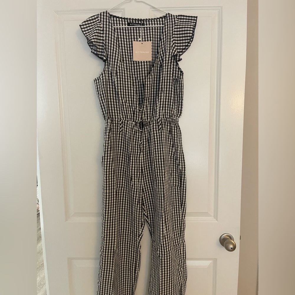 Brand new, never worn Kittenish black and white jumpsuit with pockets!